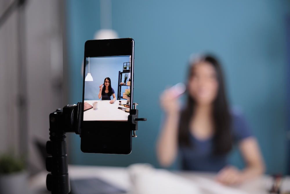 Behind the scene of beauty influencer recording makeup brush review Why You Should be Doing Reels Right Now as Part of Your Strategy Elle Marketing and Events